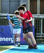 14 March 2024; Sam Cotter of CUS celebrates after scoring his side's third try during the Bank of Ireland Father Godfrey Cup final match between CUS and St Gerard's School at Energia Park in Dublin. Photo by Ben McShane/Sportsfile