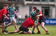 14 March 2024; Matthew Breslin of St Gerard's School is tackled by Aidan McLoughlin, left, and Finn Byrne of CUS during the Bank of Ireland Father Godfrey Cup final match between CUS and St Gerard's School at Energia Park in Dublin. Photo by Ben McShane/Sportsfile