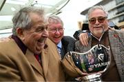 14 March 2024; Joint owners, from left, John Hales, Sir Alex Ferguson and Ged Mason celebrate with the trophy after sending out Protektorat to win the Ryanair Chase on day three of the Cheltenham Racing Festival at Prestbury Park in Cheltenham, England. Photo by David Fitzgerald/Sportsfile
