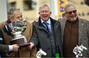 14 March 2024; Joint owners, from left, John Hales, Sir Alex Ferguson and Ged Mason celebrate with the trophy after sending out Protektorat to win the Ryanair Chase on day three of the Cheltenham Racing Festival at Prestbury Park in Cheltenham, England. Photo by David Fitzgerald/Sportsfile