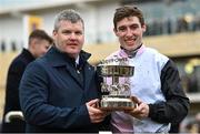14 March 2024; Jockey Jack Kennedy, right, and trainer Gordon Elliott celebrate with the trophy after winning the Paddy Power Stayers' Hurdle with Teahupooto during day three of the Cheltenham Racing Festival at Prestbury Park in Cheltenham, England. Photo by David Fitzgerald/Sportsfile