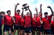 14 March 2024; CUS captain David Ginnelly lifts the cup alongside his teammates after the Bank of Ireland Father Godfrey Cup final match between CUS and St Gerard's School at Energia Park in Dublin. Photo by Ben McShane/Sportsfile