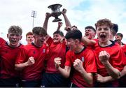 14 March 2024; CUS captain David Ginnelly lifts the cup alongside his teammates after the Bank of Ireland Father Godfrey Cup final match between CUS and St Gerard's School at Energia Park in Dublin. Photo by Ben McShane/Sportsfile