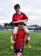14 March 2024; Ryan Lewis, bottom, and Oscar Finnegan of CUS celebrate after the Bank of Ireland Father Godfrey Cup final match between CUS and St Gerard's School at Energia Park in Dublin. Photo by Ben McShane/Sportsfile