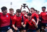14 March 2024; CUS captain David Ginnelly lifts the cup alongside his teammates after the Bank of Ireland Father Godfrey Cup final match between CUS and St Gerard's School at Energia Park in Dublin. Photo by Ben McShane/Sportsfile