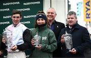 14 March 2024; Jockey Jack Kennedy, left, trainer Gordon Elliott, right, groom Erika Peciulyte and Paddy Power with their trophies after victory in the Paddy Power Stayers' Hurdle with Teahupooto during day three of the Cheltenham Racing Festival at Prestbury Park in Cheltenham, England. Photo by Harry Murphy/Sportsfile