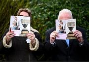 15 March 2024; Racegoers read their racecards before racing on day four of the Cheltenham Racing Festival at Prestbury Park in Cheltenham, England. Photo by Harry Murphy/Sportsfile