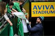 15 March 2024; Ireland head coach Andy Farrell signs autographs before an Ireland rugby captain's run at the Aviva Stadium in Dublin. Photo by Sam Barnes/Sportsfile