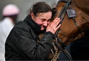 15 March 2024; Groom Emilie Seigle celebrates with Absurde after winning the BetMGM County Handicap Hurdle, with Paul Townend up, on day four of the Cheltenham Racing Festival at Prestbury Park in Cheltenham, England. Photo by David Fitzgerald/Sportsfile