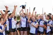 15 March 2024; Ballinrobe Community School captain Kate Brennan lifts the cup as her team-mates celebrate after the Lidl All-Ireland Post Primary School Junior C Championship final match between St Marys, Macroom, Cork and Ballinrobe Community School, Mayo at the University of Limerick. Photo by Matt Browne/Sportsfile