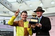 15 March 2024; Jockey Paul Townend and trainer Willie Mullins celebrate with the Gold Cup after winning the Boodles Cheltenham Gold Cup Chase with Galopin Des Champs on day four of the Cheltenham Racing Festival at Prestbury Park in Cheltenham, England. Photo by David Fitzgerald/Sportsfile