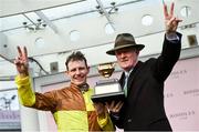 15 March 2024; Jockey Paul Townend and trainer Willie Mullins celebrate with the Gold Cup after winning the Boodles Cheltenham Gold Cup Chase with Galopin Des Champs on day four of the Cheltenham Racing Festival at Prestbury Park in Cheltenham, England. Photo by David Fitzgerald/Sportsfile