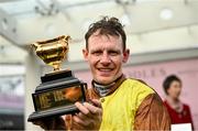 15 March 2024; Jockey Paul Townend celebrates with the Gold Cup after winning the Boodles Cheltenham Gold Cup Chase with Galopin Des Champs on day four of the Cheltenham Racing Festival at Prestbury Park in Cheltenham, England. Photo by David Fitzgerald/Sportsfile