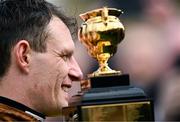 15 March 2024; Jockey Paul Townend celebrates with the Gold Cup after winning the Boodles Cheltenham Gold Cup Chase with Galopin Des Champs on day four of the Cheltenham Racing Festival at Prestbury Park in Cheltenham, England. Photo by Harry Murphy/Sportsfile
