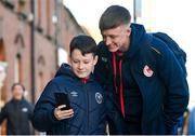 15 March 2024; St Patrick's Athletic supporter Charlie Darcy, age 10, from Palmerstown, Dublin, takes a selfie with Chris Forrester of St Patrick's Athletic before the SSE Airtricity Men's Premier Division match between St Patrick's Athletic and Shelbourne at Richmond Park in Dublin. Photo by Seb Daly/Sportsfile