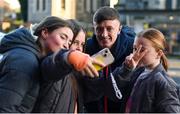 15 March 2024; St Patrick's Athletic player Chris Forrester takes a selfie with supporters before the SSE Airtricity Men's Premier Division match between St Patrick's Athletic and Shelbourne at Richmond Park in Dublin. Photo by Shauna Clinton/Sportsfile