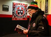 15 March 2024; Programme seller Gerry Juhel inspects the matchday programme before the SSE Airtricity Men's Premier Division match between Bohemians and Derry City at Dalymount Park in Dublin. Photo by Tyler Miller/Sportsfile