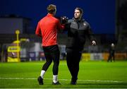 15 March 2024; Derry City manager Ruaidhrí Higgins and Bohemians goalkeeper James Talbot before the SSE Airtricity Men's Premier Division match between Bohemians and Derry City at Dalymount Park in Dublin. Photo by Stephen McCarthy/Sportsfile