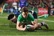 15 March 2024; Hugo McLaughlin of Ireland scores his side's first try despite the tackle of Jerry Blyth-Lafferty of Scotland during the U20 Six Nations Rugby Championship match between Ireland and Scotland at Virgin Media Park in Cork. Photo by Brendan Moran/Sportsfile