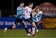 15 March 2024; Zak Bradshaw of Dundalk in action against Harvey Macadam of Waterford during the SSE Airtricity Men's Premier Division match between Dundalk and Waterford at Oriel Park in Dundalk, Louth. Photo by Ramsey Cardy/Sportsfile