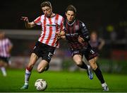 15 March 2024; Daniel Kelly of Derry City in action against Paddy Kirk of Bohemians during the SSE Airtricity Men's Premier Division match between Bohemians and Derry City at Dalymount Park in Dublin. Photo by Tyler Miller/Sportsfile