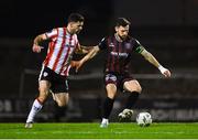15 March 2024; Jordan Flores of Bohemians in action against Patrick Hoban of Derry City during the SSE Airtricity Men's Premier Division match between Bohemians and Derry City at Dalymount Park in Dublin. Photo by Tyler Miller/Sportsfile