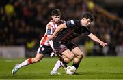 15 March 2024; James Clarke of Bohemians in action against Adam O'Reilly of Derry City during the SSE Airtricity Men's Premier Division match between Bohemians and Derry City at Dalymount Park in Dublin. Photo by Stephen McCarthy/Sportsfile
