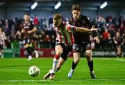 15 March 2024; Ronan Boyce of Derry City in action against Paddy Kirk of Bohemians during the SSE Airtricity Men's Premier Division match between Bohemians and Derry City at Dalymount Park in Dublin. Photo by Tyler Miller/Sportsfile