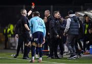 15 March 2024; Referee Kevin O'Sullivan shows a red card to Dundalk assistant manager Patrick Cregg, hidden, during the SSE Airtricity Men's Premier Division match between Dundalk and Waterford at Oriel Park in Dundalk, Louth. Photo by Ramsey Cardy/Sportsfile