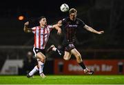 15 March 2024; Jevon Mills of Bohemians in action against Patrick Hoban of Derry City during the SSE Airtricity Men's Premier Division match between Bohemians and Derry City at Dalymount Park in Dublin. Photo by Tyler Miller/Sportsfile