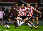 15 March 2024; Filip Piszczek of Bohemians is tackled by Mark Connolly of Derry City, centre, and Sam Todd during the SSE Airtricity Men's Premier Division match between Bohemians and Derry City at Dalymount Park in Dublin. Photo by Tyler Miller/Sportsfile