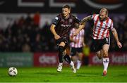 15 March 2024; Filip Piszczek of Bohemians in action against Mark Connolly of Derry City during the SSE Airtricity Men's Premier Division match between Bohemians and Derry City at Dalymount Park in Dublin. Photo by Tyler Miller/Sportsfile