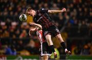 15 March 2024; Jevon Mills of Bohemians in action against Patrick Hoban of Derry City during the SSE Airtricity Men's Premier Division match between Bohemians and Derry City at Dalymount Park in Dublin. Photo by Stephen McCarthy/Sportsfile