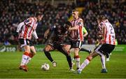 15 March 2024; James Akintunde of Bohemians in action against Derry City players, from left, Paul McMullan, Ronan Boyce and Daniel Kelly during the SSE Airtricity Men's Premier Division match between Bohemians and Derry City at Dalymount Park in Dublin. Photo by Stephen McCarthy/Sportsfile