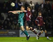 15 March 2024; Rory Gaffney of Shamrock Rovers in action against Robert Slevin of Galway United during the SSE Airtricity Men's Premier Division match between Galway United and Shamrock Rovers at Eamonn Deacy Park in Galway. Photo by Piaras Ó Mídheach/Sportsfile