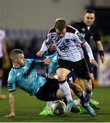 15 March 2024; Daryl Horgan of Dundalk is tackled by Niall O'Keeffe of Waterford during the SSE Airtricity Men's Premier Division match between Dundalk and Waterford at Oriel Park in Dundalk, Louth. Photo by Ramsey Cardy/Sportsfile