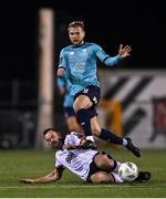 15 March 2024; Rowan McDonald of Waterford is tackled by Robbie Benson of Dundalk during the SSE Airtricity Men's Premier Division match between Dundalk and Waterford at Oriel Park in Dundalk, Louth. Photo by Ramsey Cardy/Sportsfile