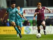 15 March 2024; Aodh Dervin of Galway United in action against Roberto Lopes of Shamrock Rovers during the SSE Airtricity Men's Premier Division match between Galway United and Shamrock Rovers at Eamonn Deacy Park in Galway. Photo by Piaras Ó Mídheach/Sportsfile