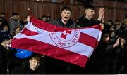 15 March 2024; Shelbourne supporters celebrate after their side's victory in the SSE Airtricity Men's Premier Division match between St Patrick's Athletic and Shelbourne at Richmond Park in Dublin. Photo by Seb Daly/Sportsfile