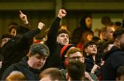 15 March 2024; Bohemians supporters celebrate after their side's victory in the SSE Airtricity Men's Premier Division match between Bohemians and Derry City at Dalymount Park in Dublin. Photo by Tyler Miller/Sportsfile