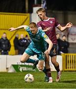 15 March 2024; Darragh Nugent of Shamrock Rovers in action against Robert Slevin of Galway United during the SSE Airtricity Men's Premier Division match between Galway United and Shamrock Rovers at Eamonn Deacy Park in Galway. Photo by Piaras Ó Mídheach/Sportsfile