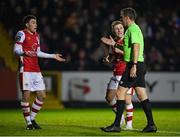 15 March 2024; St Patrick's Athletic players Kian Leavy, left, and Brandon Kavanagh remonstrate with referee Robert Harvey during the SSE Airtricity Men's Premier Division match between St Patrick's Athletic and Shelbourne at Richmond Park in Dublin. Photo by Seb Daly/Sportsfile