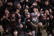 15 March 2024; Bohemians supporters celebrate after the SSE Airtricity Men's Premier Division match between Bohemians and Derry City at Dalymount Park in Dublin. Photo by Stephen McCarthy/Sportsfile