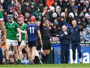 16 March 2024; Shane O'Brien of Limerick, red helmet, is shown a red card by referee Thomas Walsh during the Allianz Hurling League Division 1 Group B match between Galway and Limerick at Pearse Stadium in Galway. Photo by Stephen McCarthy/Sportsfile