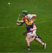 16 March 2024; Darragh Carley of Wexford is tackled by Seamus Harnedy of Cork during the Allianz Hurling League Division 1 Group A match between Wexford and Cork at Chadwicks Wexford Park in Wexford. Photo by Ray McManus/Sportsfile