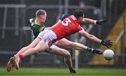 16 March 2024; Mathew Costello of Meath scores his side's first goal despite the attention of Daniel O'Mahony of Cork during the Allianz Football League Division 2 match between Meath and Cork at Páirc Tailteann in Navan, Meath. Photo by Ben McShane/Sportsfile