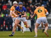 16 March 2024; Jason Forde of Tipperary in action against Paddy Burke, left, and Ryan McGarry of Antrim during the Allianz Hurling League Division 1 Group B match between Antrim and Tipperary at Corrigan Park in Belfast. Photo by Ramsey Cardy/Sportsfile