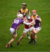 16 March 2024; Ger Millerick of Cork is tackled by Joe O'Connor, 18, and Conor Hearne of Wexford during the Allianz Hurling League Division 1 Group A match between Wexford and Cork at Chadwicks Wexford Park in Wexford. Photo by Ray McManus/Sportsfile