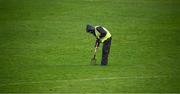 16 March 2024; A groundsman repairs the ground at half time during the Allianz Hurling League Division 1 Group A match between Wexford and Cork at Chadwicks Wexford Park in Wexford. Photo by Ray McManus/Sportsfile
