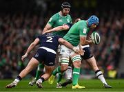 16 March 2024; Tadhg Beirne of Ireland is tackled by George Turner of Scotland during the Guinness Six Nations Rugby Championship match between Ireland and Scotland at the Aviva Stadium in Dublin. Photo by Harry Murphy/Sportsfile